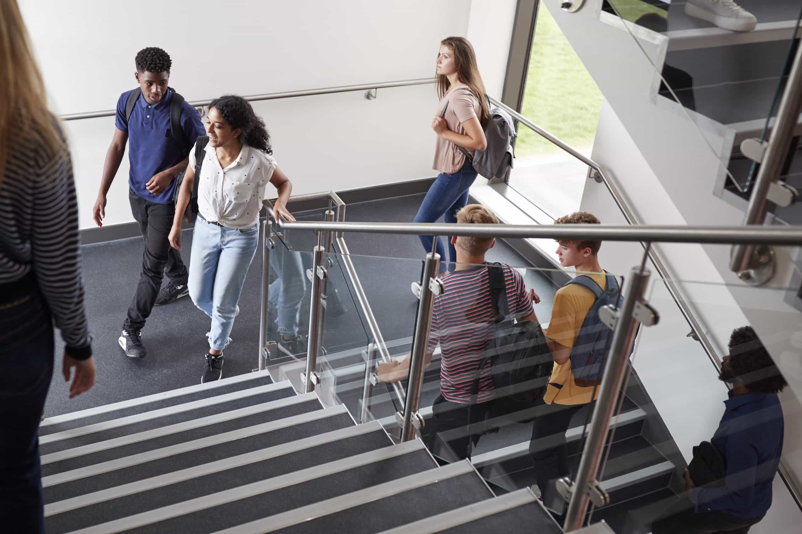 Students walking up the stairs of their sixth form.